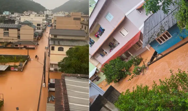Moradores de Marechal Floriano ES andam com água na cintura na rua alagada por chuva.